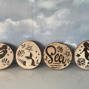 Mermaid wooden pyrography coasters.