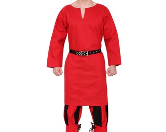 May include: A red tunic with long sleeves and a V-neckline. The tunic is belted at the waist with a black leather belt. The person is wearing black and red striped pants with black laces at the bottom.