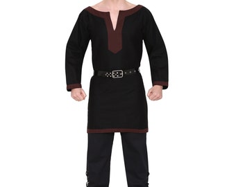 May include: A black tunic with brown trim and long sleeves. The tunic has a V-neck and is belted at the waist. The person is wearing black trousers and brown shoes.