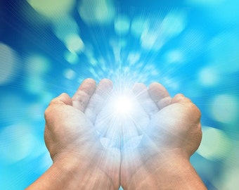May include: Two hands cupped together with a bright white light shining from within, against a blue and white blurred background.