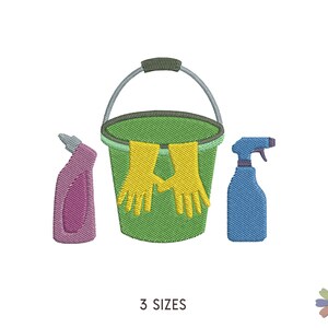 May include: A green bucket with a yellow pair of rubber gloves hanging over the rim. A purple cleaning spray bottle and a blue spray bottle are on either side of the bucket.