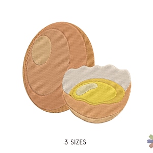 Puede incluir: Un diseño bordado de un huevo marrón con una yema agrietada. El huevo está en un estilo de dibujos animados y es perfecto para un proyecto de cocina o de temática de desayuno.