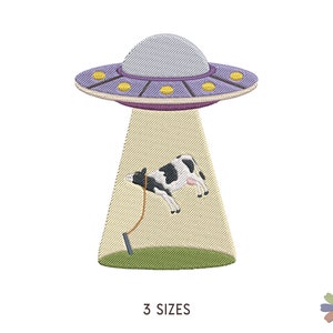 May include: An embroidered design of a UFO abducting a black and white cow. The UFO is purple and has yellow lights. The cow is being lifted by a beam of light from the UFO.