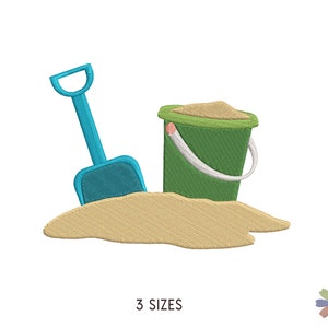 May include: A blue plastic shovel and a green plastic bucket with sand inside, sitting on a pile of tan sand.  The text "3 SIZES" is below the image.