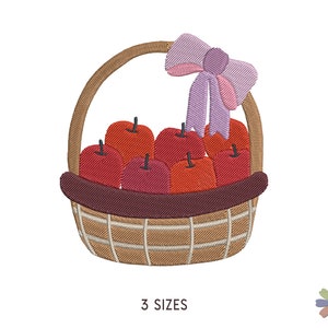 May include: A brown wicker basket with a purple bow on top, filled with red apples. The basket is sitting on a white background. 3 SIZES.