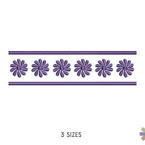 May include: A purple floral embroidery design featuring six daisy-like flowers. The design is bordered by two parallel lines. The text "3 SIZES" is at the bottom of the image. A small floral logo is in the bottom right corner.