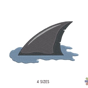 May include: An embroidered patch design featuring a dark gray shark fin emerging from a light blue water splash. The embroidery shows detailed stitching patterns throughout the fin and the surrounding water, with the text 4 SIZES printed below.