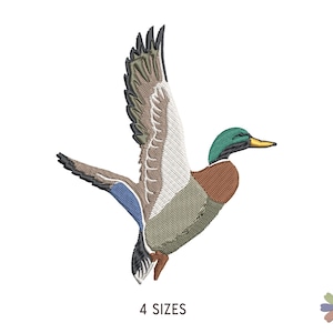May include: An embroidered patch featuring a mallard duck in flight with wings spread upward. The duck has a green head, yellow beak, brown chest, and grey body with blue and white wing details. The text 4 SIZES is printed below the duck.