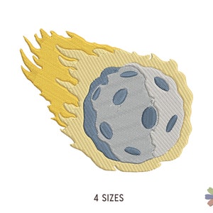 May include: A gray and blue comet with a yellow tail. The comet is a digital embroidery design.