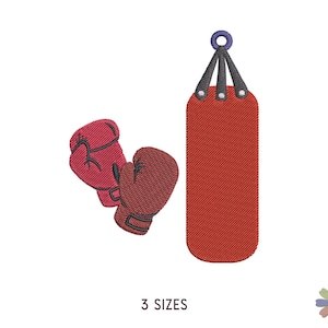 Puede incluir: Guantes de boxeo rojos y negros y un saco de boxeo rojo colgado de un gancho negro y azul. El saco de boxeo tiene una superficie texturizada.