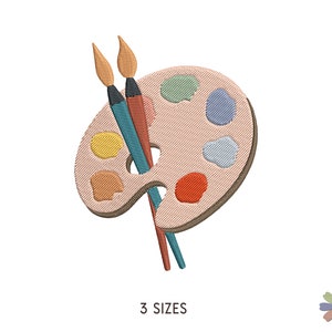 May include: A brown and beige paint palette with a variety of colorful paint wells. Two paintbrushes are crossed on top of the palette. The paintbrushes are blue, orange, and yellow.