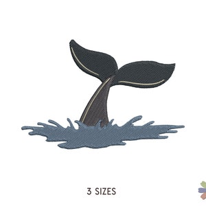 May include: A black whale tail with a blue water splash. The tail is sticking up out of the water.