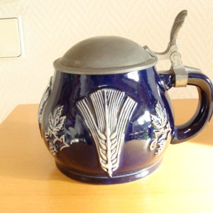 Beautiful vintage German beer mug with lid