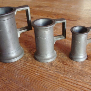 Tinplate capacity measures, late 19th/early 20th century / spirits