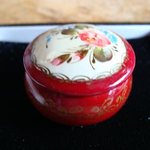 Small red wooden box with flowers