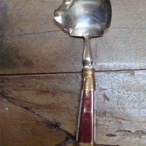Old art deco fruit pouring ladle in silverware and porcelain