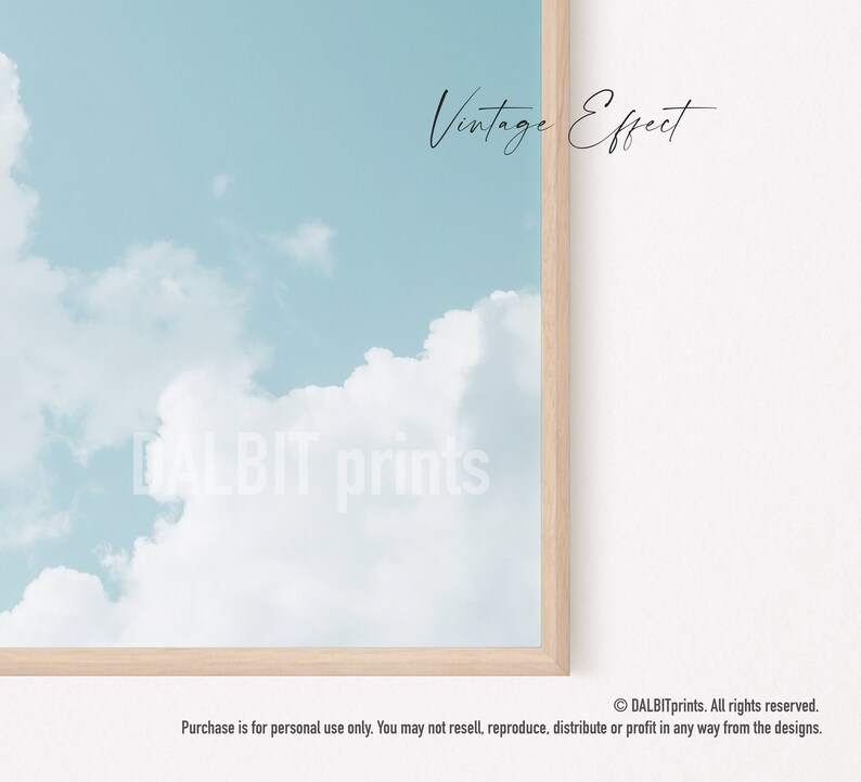 May include: A digital illustration of a light blue sky with white clouds. The text "Vintage Effect" is written in black cursive at the top of the image. The text "DALBIT prints" is written in white cursive at the bottom of the image.