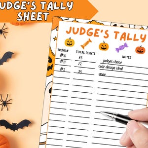 May include: A Halloween-themed Judge's Tally Sheet with orange pumpkins, candy, and jack-o'-lantern illustrations. The sheet includes columns for trunk numbers, total points, and notes. Black bats and spiders decorate the background.