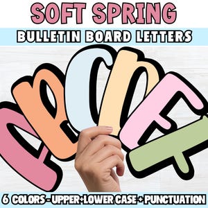 May include: Soft Spring bulletin board letters in pastel colors. The letters A, B, C, E, and F are displayed in shades of pink, orange, light blue, yellow, and green. The text at the bottom reads "6 COLORS - UPPER + LOWER CASE + PUNCTUATION."