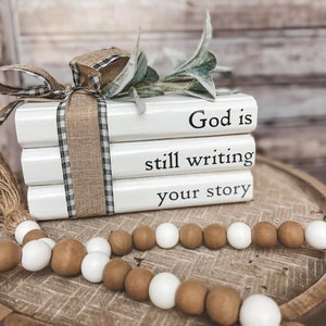 Farmhouse book stack decor // bookstack // God is still writing our story // vintage decor // books