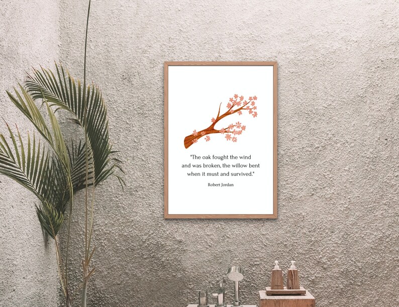 May include: A printable quote about resilience featuring a watercolor illustration of a brown branch with pink blossoms. The quote reads "The oak fought the wind and was broken, the willow bent when it must and survived." - Robert Jordan.