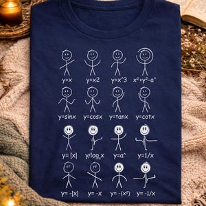 May include: A navy blue t-shirt with white stick figure illustrations representing mathematical functions. The word "marine" is written in white script at the top. The shirt features equations like y=x, y=sinx, and y=|x|.