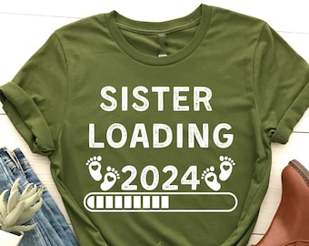 Schwester Wird geladen 2024 T-Shirt, Werdende Schwester T-Shirt, Schwangerschaft, Schwester Geburtstagsgeschenk, Neue Mutter T-Shirt