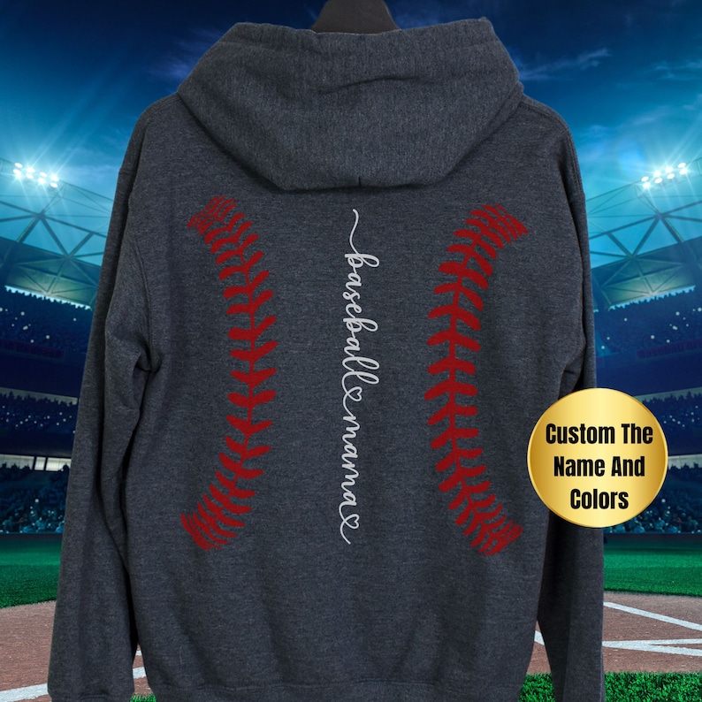 May include: A dark gray hooded sweatshirt with a red baseball stitch design and the text "baseball mama" in white cursive on the back.