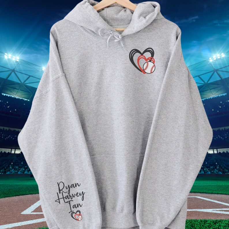 May include: Gray hooded sweatshirt with the names "Ryan Harvey Ian" and a baseball with two hearts on the sleeve.