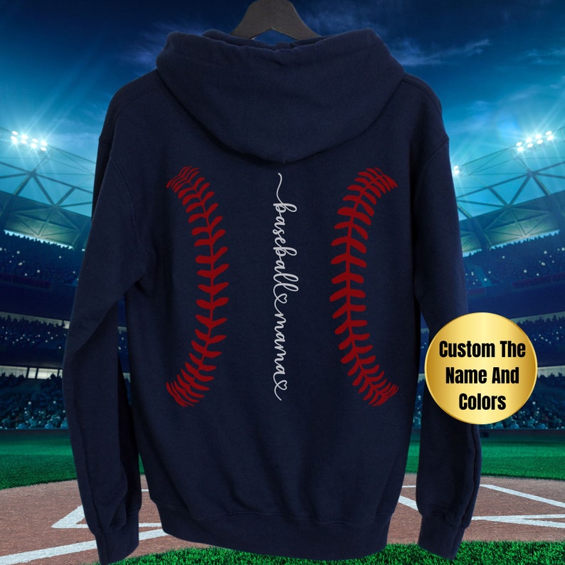May include: Navy blue hooded sweatshirt with a red and white baseball graphic and the text "baseball mama" in white cursive on the back.