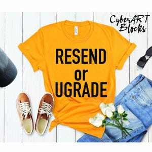 May include: A yellow t-shirt with the text "RESEND or UPGRADE" printed in black.