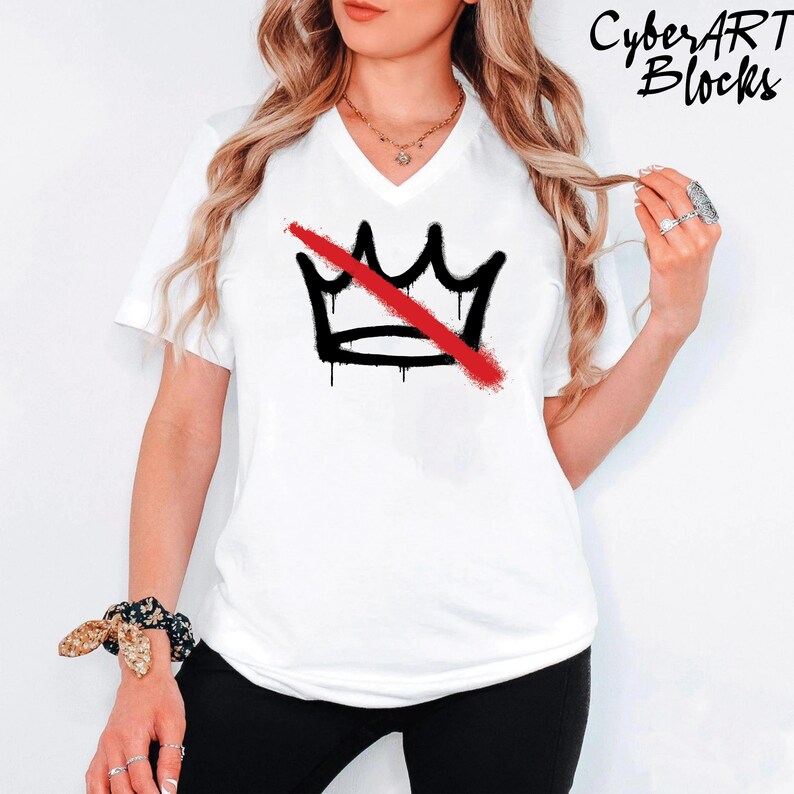 A woman wearing a white t-shirt with a graphic design of a crown and a red diagonal line across it.