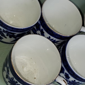 Set of 4 Blue and White Miniature Porcelain Tea Cups with Flowers and Gold Trimmed Design