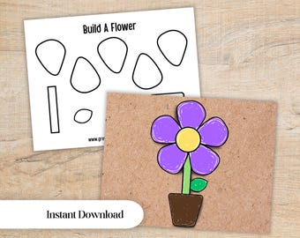 May include: A printable activity sheet titled Build A Flower with black outlines of flower parts and a completed example showing a purple flower with a yellow center, a green stem and leaf, and a brown pot on a textured brown background.