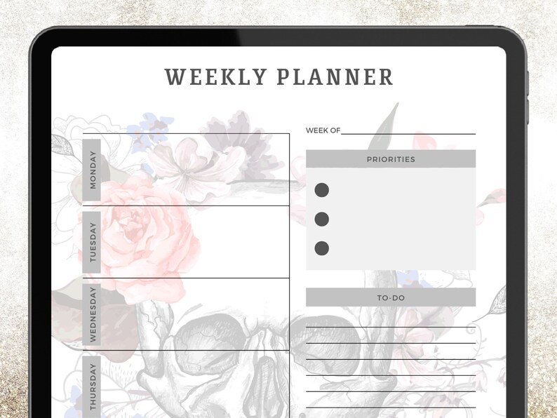May include: A digital weekly planner displayed on a tablet. The planner features a floral and skull design with sections for each day of the week, priorities, and to-do lists. The text "WEEKLY PLANNER" is at the top.