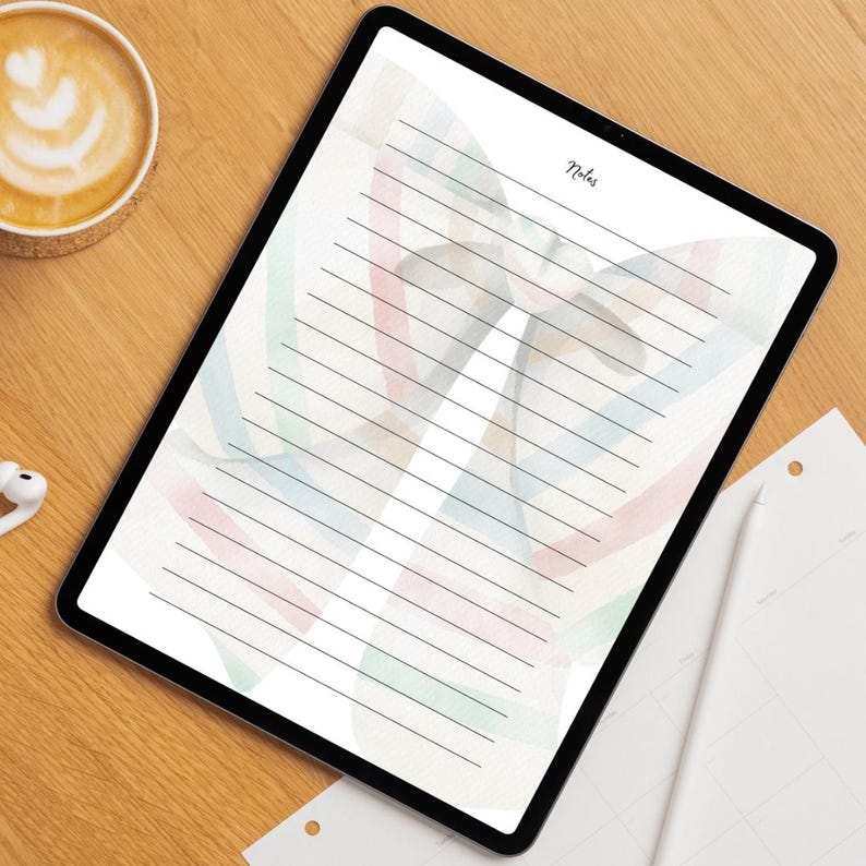 Peut inclure: Une tablette num&eacute;rique affichant une page de notes lign&eacute;e avec un motif de papillon &agrave; l'aquarelle aux couleurs pastel. Le mot "Notes" est &eacute;crit en haut. Une tasse de caf&eacute; et des &eacute;couteurs sont sur une surface en bois.