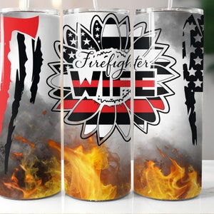 May include: A stainless steel tumbler with a design featuring a sunflower with the words "Firefighter WIFE" in the center. The design includes a red and black stripe, a distressed American flag, and flames at the bottom.