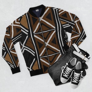May include: A black bomber jacket with a brown and white geometric pattern. The jacket has a zipper closure and a ribbed collar, cuffs, and hem.