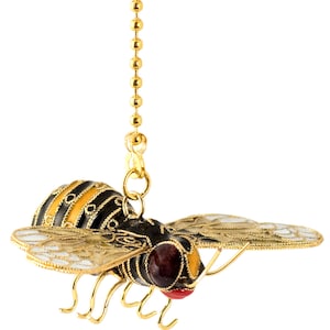 May include: A gold chain with a black and yellow bee pendant. The bee has white and gold wings and red eyes. The bee is a decorative pull for a light fixture.