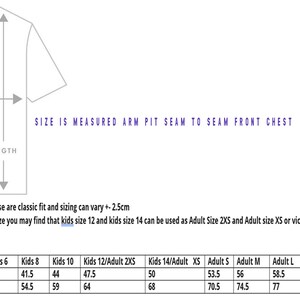 May include: Size chart for t-shirts in centimeters. The chart shows chest and length measurements for kids sizes 2 through 14 and adult sizes XS through 3XL.  The text states that the t-shirts are a classic fit and sizing can vary by 2.5 centimeters.  It also notes that kids sizes 12 and 14 can be used as adult sizes 2XS and XS, or vice versa.