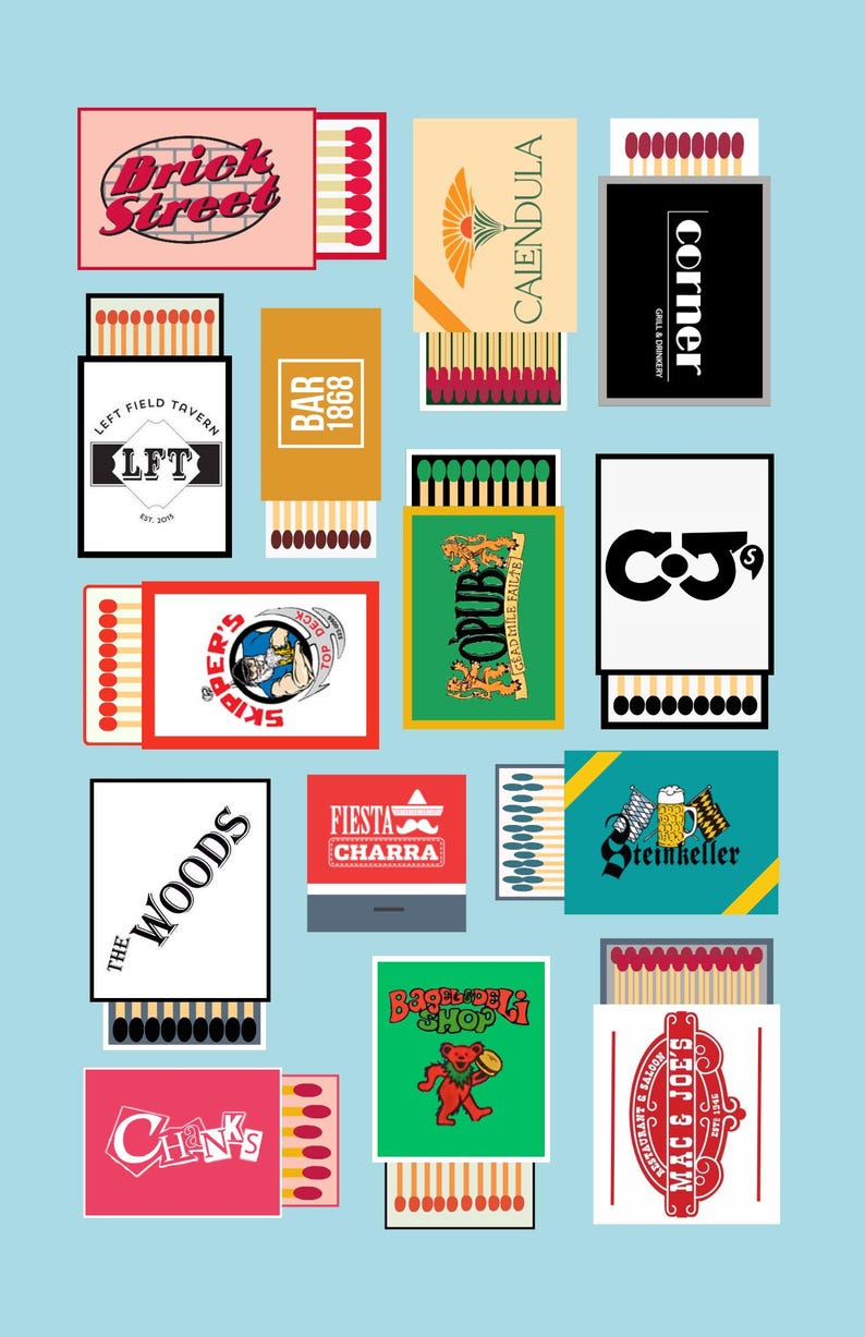 May include: A collection of matchboxes with various designs and text on a light blue background. The matchboxes feature logos for businesses like "Brick Street," "Left Field Tavern," "Skipper's," and "Fiesta Charra." Each box has a striking color scheme.