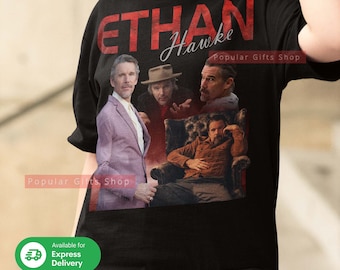 May include: Black t-shirt with a red and white graphic print of Ethan Hawke. The graphic includes four images of Ethan Hawke in different roles. The text "Ethan Hawke" is printed in red and white letters. The text "Popular Gifts Shop" is printed in white letters.