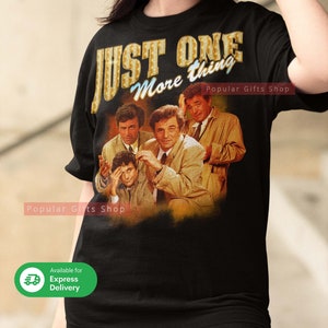 May include: Black t-shirt with a vintage-style graphic of four men from the TV show "The Rockford Files" and the text "Just One More Thing" in gold letters. The text "Popular Gifts Shop" appears twice on the shirt.