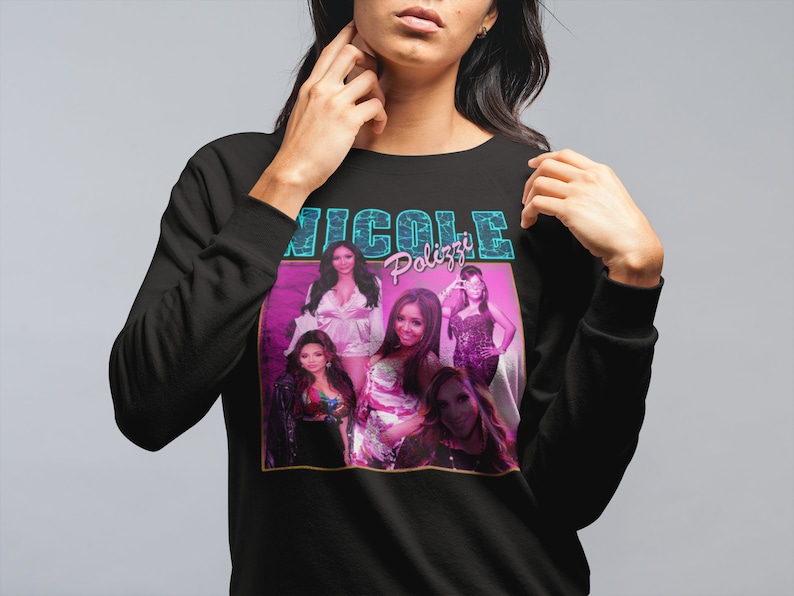 May include: Black sweatshirt with a graphic print of five women. The print features the text "Nicole Polizzi" in a blue and pink font.
