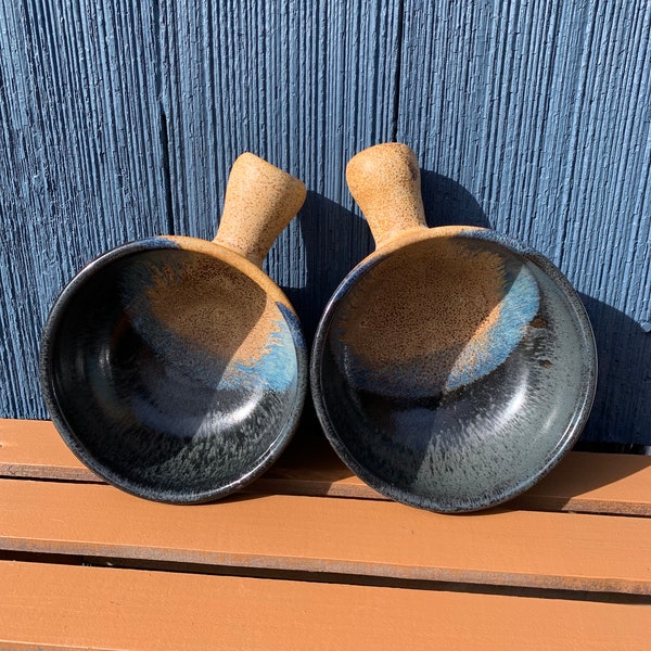 stoneware bowl. 16oz stoneware bowl with lug handle. Unique handle design, glazed in dark blue and tan. Food, dishwasher, microwave safe