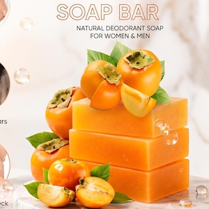 May include: A stack of three orange persimmon soap bars with fresh persimmon fruits and green leaves. The text reads CONTROL BODY ODOR, PERSIMMON SOAP BAR, and N.W 3.53oz / 100g. Six circular icons illustrate body areas for application.