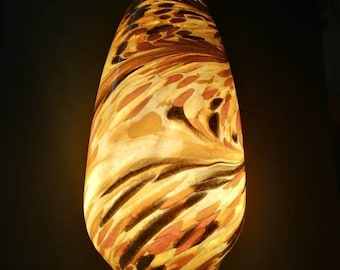 Large glass lamp as mood lighting in brown amber color of glass