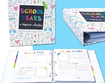 May include: A white binder with a colorful doodle pattern on the cover. The cover says "School Years, a keepsake adventure". The binder is open to show pages with the headings "Grade Two" and "Grade Three".