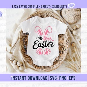 May include: White baby bodysuit with pink bunny ears, the text "my first Easter", and pink paw prints. The bodysuit is displayed in a woven basket with decorative elements. The image also includes the text "EASY LAYER CUT FILE • CRICUT • SILHOUETTE" and "INSTANT DOWNLOAD | SVG PNG EPS".
