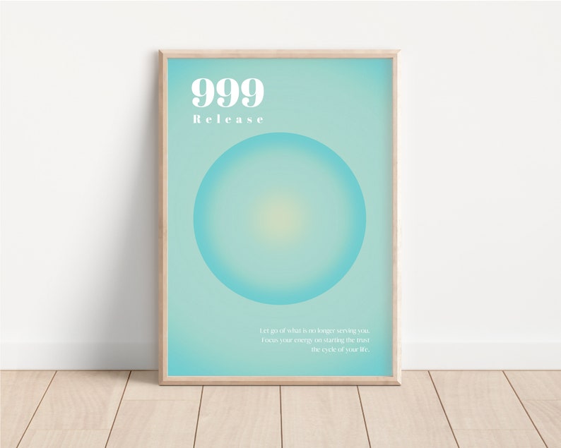 May include: A framed poster with a light blue background and a large, light blue circle in the center. The text "999 Release" is at the top of the poster. The text "Let go of what is no longer serving you. Focus your energy on starting the next cycle of your life." is at the bottom of the poster.